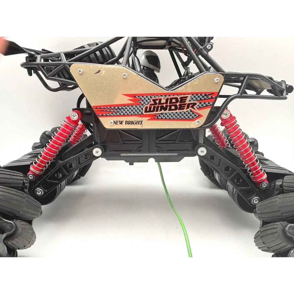 New Bright Slide Winder 4x4 RC Monster Truck Black Red Gold Roll Cage Toy